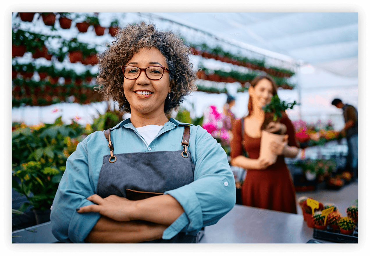 Plant nursery owner helping a customer